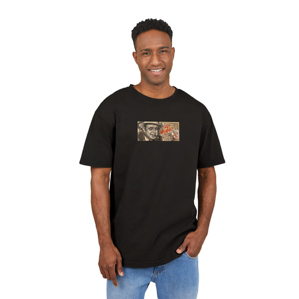 Man wearing a black t-shirt with a graphic dollar design on a white background, front